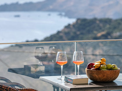 Enjoy your breakfast with the amazing view from the balcony of a Deluxe Suite