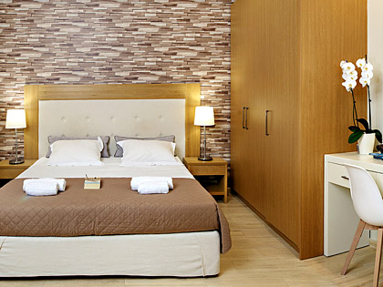 The luxurious bedroom of a Top Floor Junior Suite with the amazing COCO-MAT king-size bed