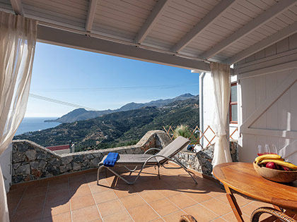 Enjoy the sun and the view of the sea & mountains from the balcony of a Deluxe apartment