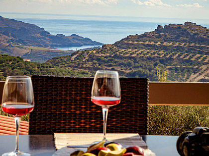 Enjoy a glass of wine on the balconies of AnnaView Apartments & Suites